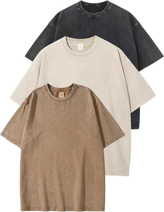 Three t-shirts in black, beige, and brown on a white background