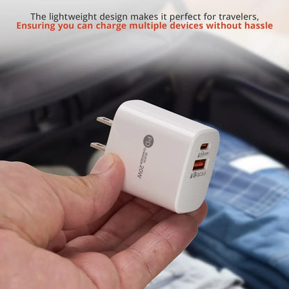 White USB charger held in a hand with text about its suitability for travelers.