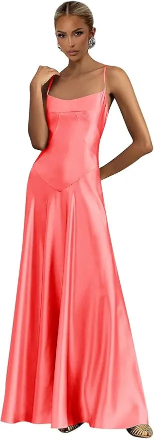 Woman wearing a coral pink evening gown against a white background