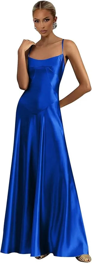 Woman wearing a blue satin dress against a neutral background