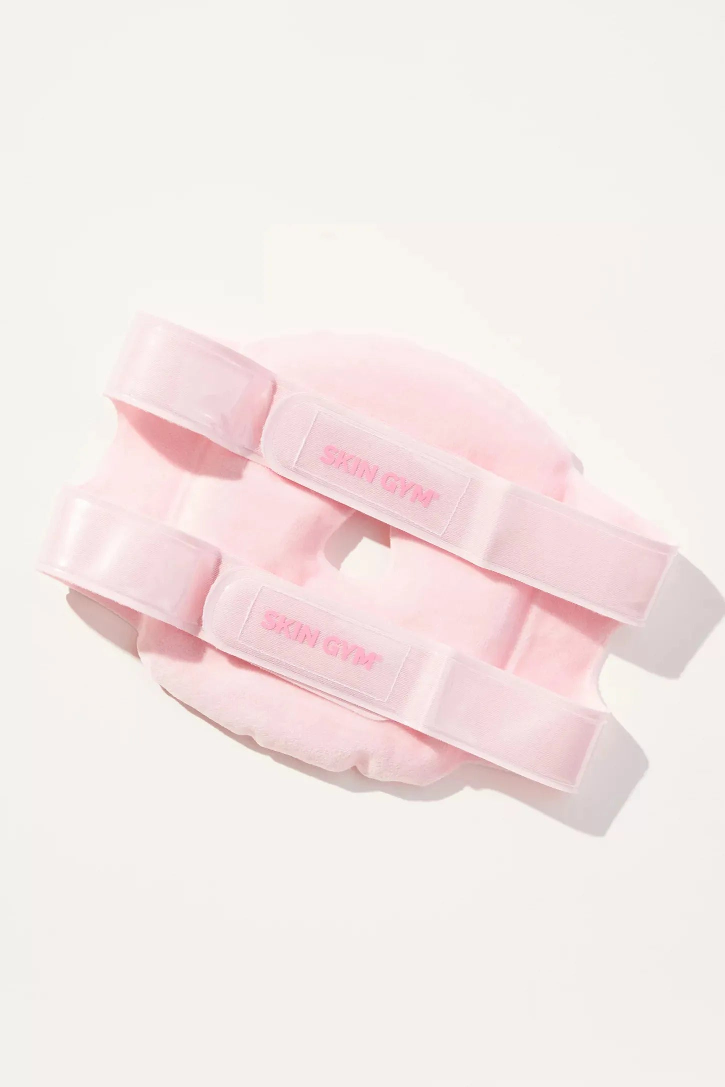 Two pink weightlifting belts with 'Body Solid' branding on a white background