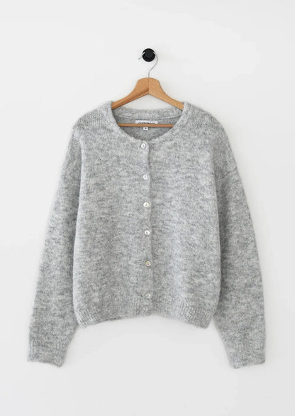 Gray cardigan on a hanger against a white background