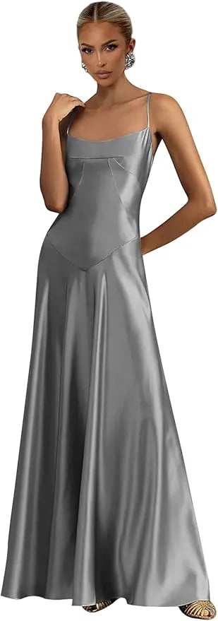 Woman wearing a silver satin gown on a white background