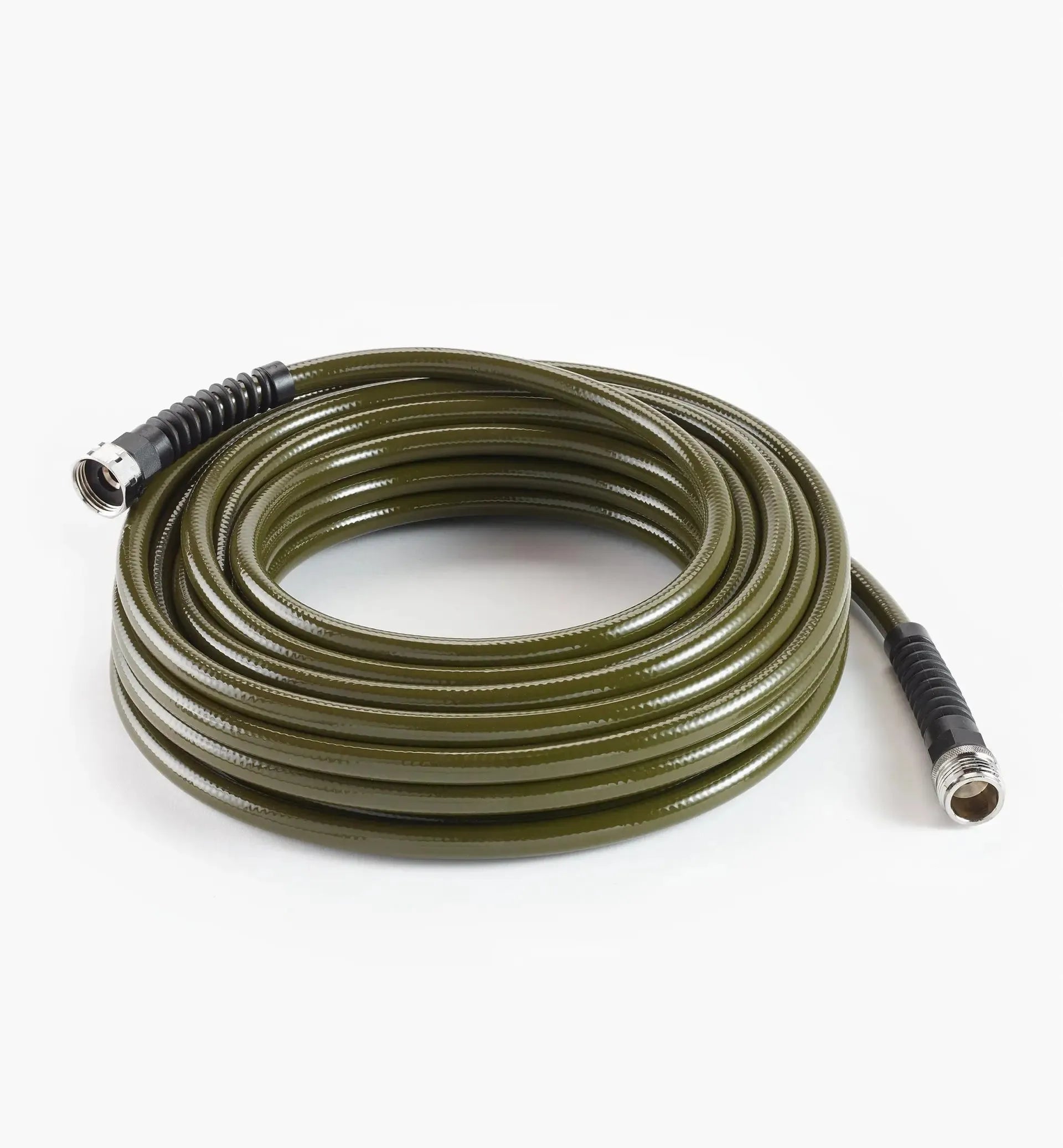 Coiled green garden hose on a white background