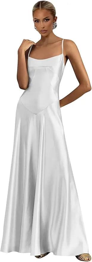 Woman wearing a white satin evening gown on a plain background